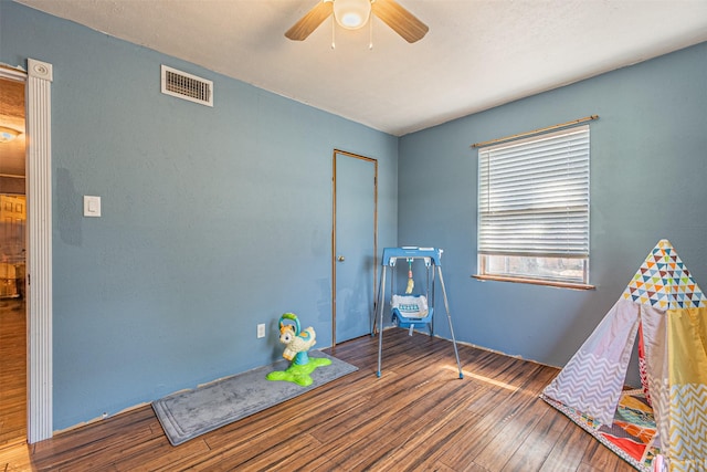 rec room featuring ceiling fan and wood-type flooring