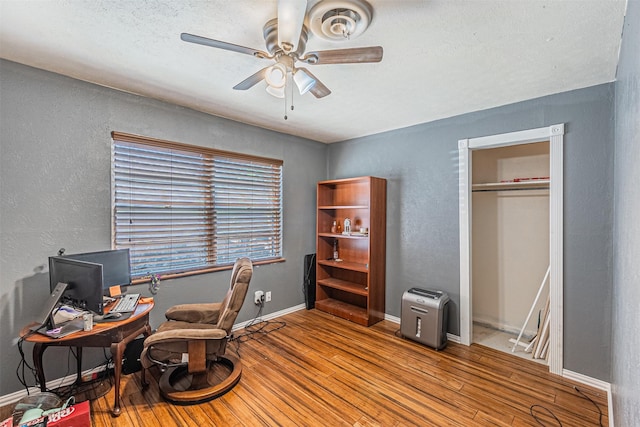 office with ceiling fan and wood-type flooring