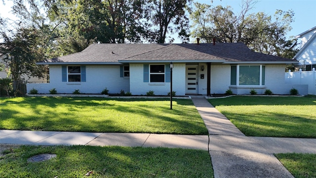 ranch-style house featuring a front yard