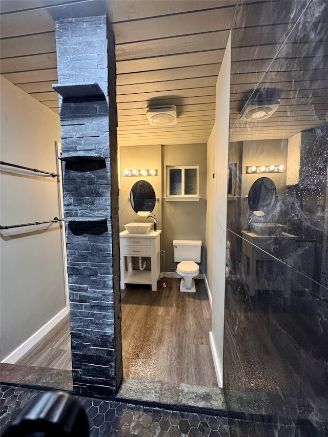 bathroom featuring sink, wood ceiling, hardwood / wood-style flooring, and toilet