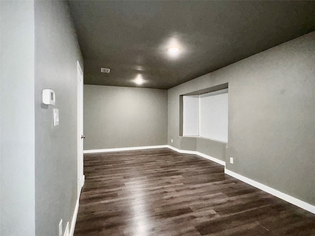 empty room featuring dark hardwood / wood-style floors