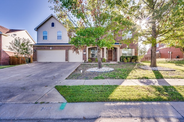 front facade featuring a front yard and a garage