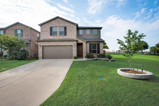 view of front of home featuring a garage and a front yard