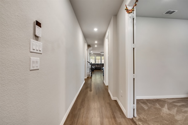 corridor featuring hardwood / wood-style flooring