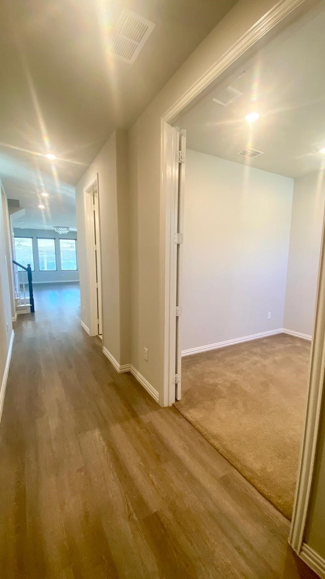 hallway featuring hardwood / wood-style flooring