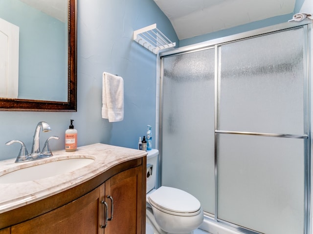 bathroom featuring walk in shower, vanity, and toilet