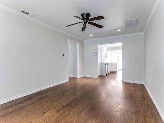 unfurnished room featuring ornamental molding, ceiling fan, and dark hardwood / wood-style floors