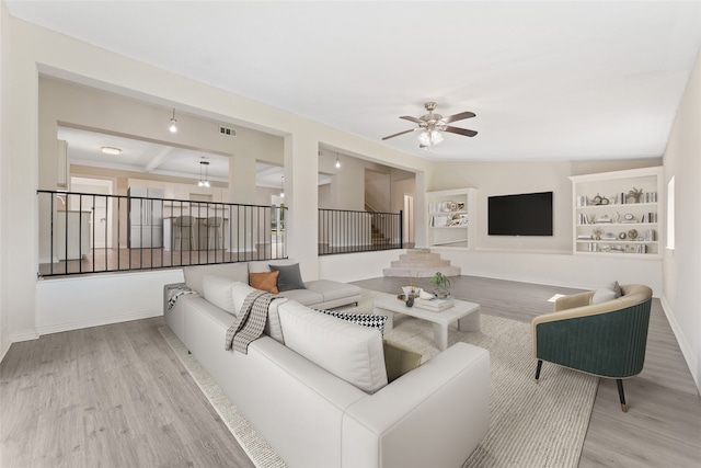 kitchen with light hardwood / wood-style floors, white cabinetry, backsplash, decorative light fixtures, and a center island