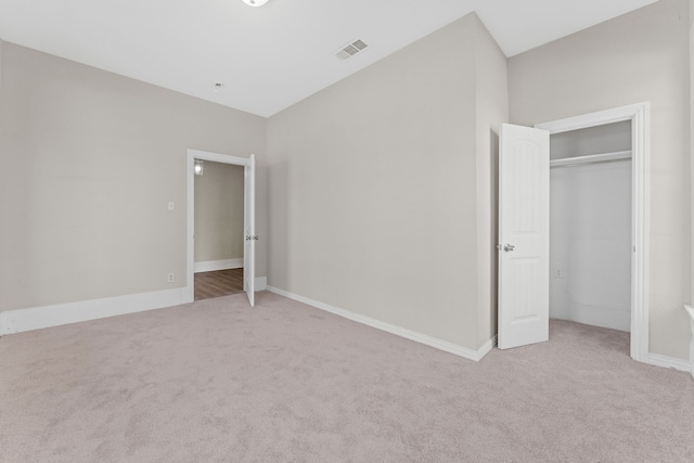 unfurnished living room featuring hardwood / wood-style floors, beam ceiling, and sink