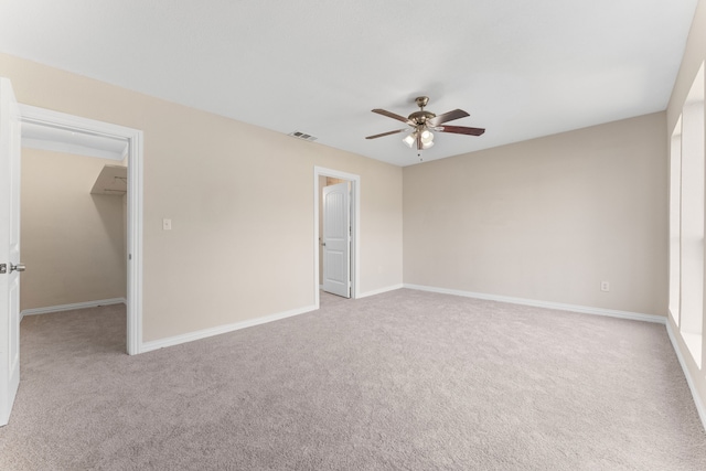 unfurnished living room featuring light hardwood / wood-style flooring, vaulted ceiling with beams, and ceiling fan