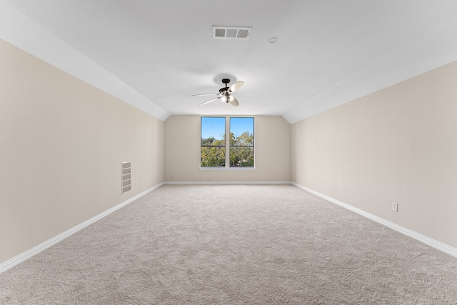 unfurnished living room with ceiling fan, light wood-type flooring, and lofted ceiling with beams