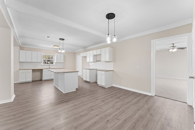 interior space featuring plenty of natural light and light carpet