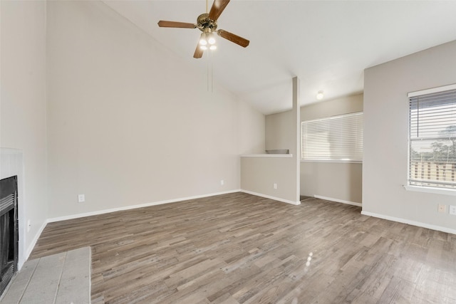 unfurnished living room with ceiling fan, light hardwood / wood-style flooring, and lofted ceiling