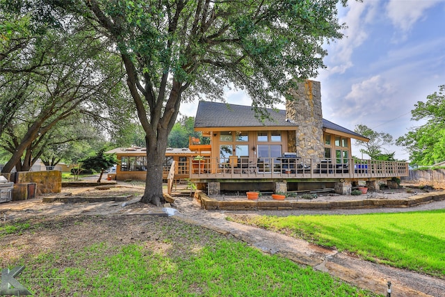 back of property featuring a deck