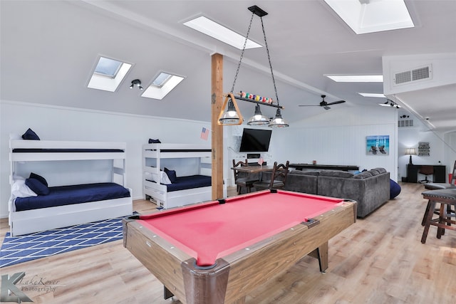 rec room featuring ceiling fan, hardwood / wood-style flooring, billiards, and lofted ceiling with skylight