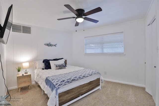 bedroom with carpet floors, ceiling fan, and a closet