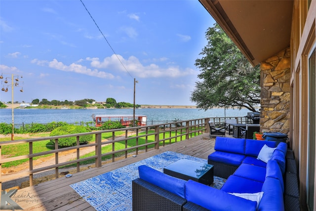 deck featuring an outdoor hangout area and a water view