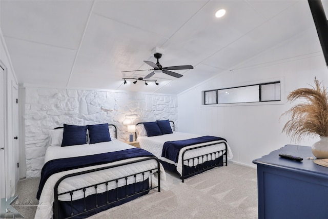 bedroom featuring lofted ceiling, ceiling fan, and carpet flooring