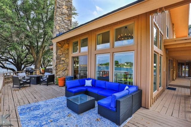 wooden terrace featuring an outdoor hangout area