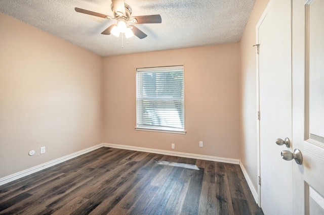 empty room with dark wood finished floors, ceiling fan, baseboards, and a textured ceiling