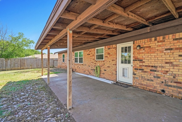 view of patio featuring fence