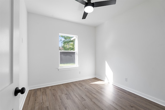 empty room featuring light hardwood / wood-style flooring and ceiling fan