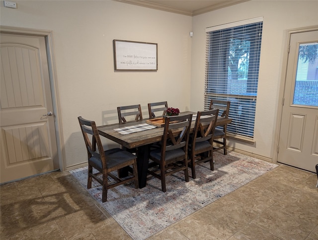 dining area featuring ornamental molding