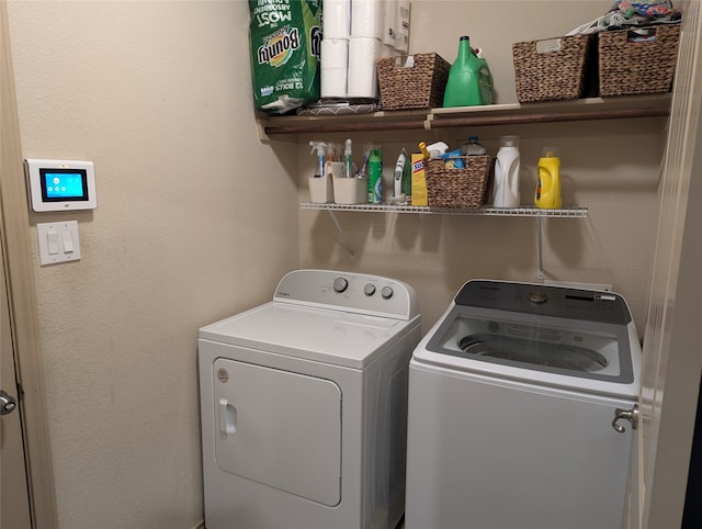 laundry room with washing machine and dryer