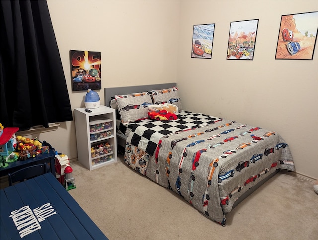 bedroom featuring light colored carpet