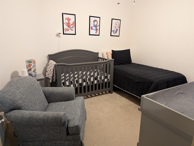 bedroom featuring light colored carpet