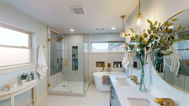 ensuite bathroom with double vanity, a sink, baseboards, and connected bathroom