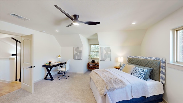 carpeted bedroom featuring vaulted ceiling and ceiling fan