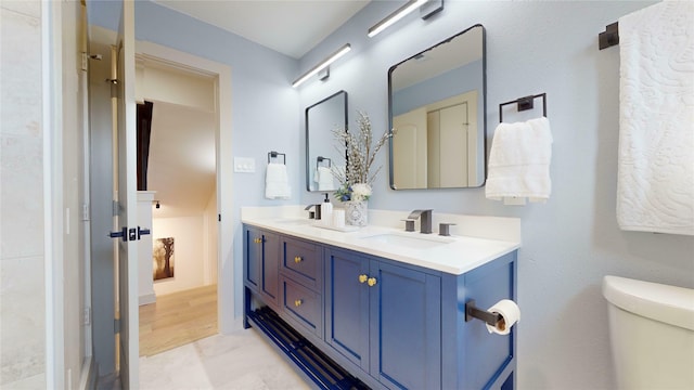 bathroom featuring hardwood / wood-style flooring, vanity, and toilet