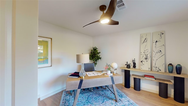 dining space with visible vents, baseboards, and light wood finished floors