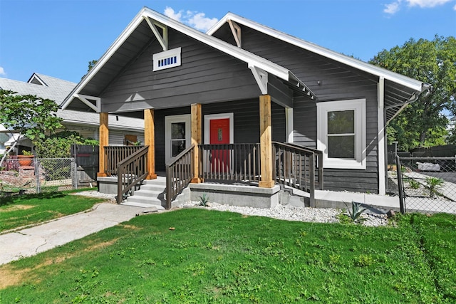 view of front facade featuring a front yard and a porch