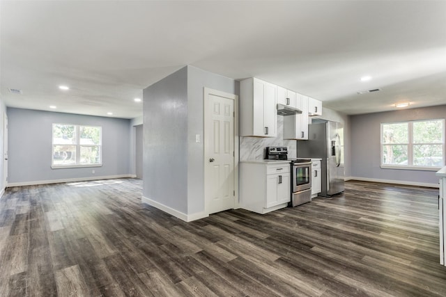 unfurnished room with dark hardwood / wood-style floors and ceiling fan