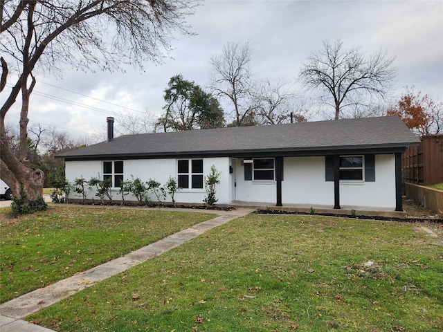 single story home featuring a front yard and covered porch