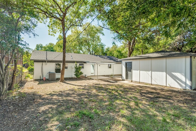 back of property featuring cooling unit