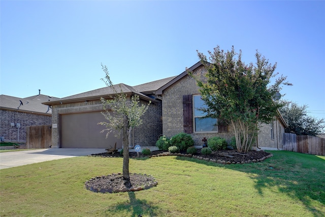 view of front facade with a front yard and a garage