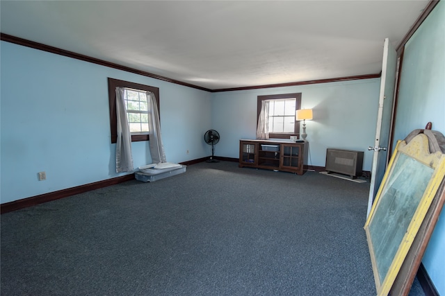 carpeted empty room featuring crown molding