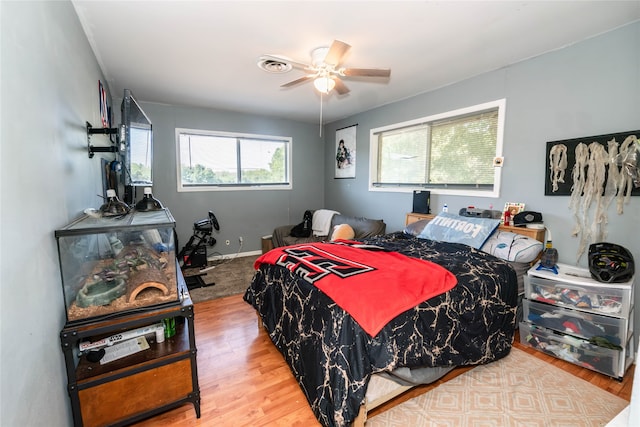 bedroom featuring ceiling fan and hardwood / wood-style flooring