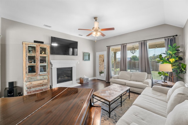 living room featuring lofted ceiling, ceiling fan, and hardwood / wood-style floors