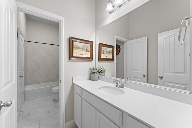 full bathroom featuring tile patterned floors, tiled shower / bath, vanity, and toilet