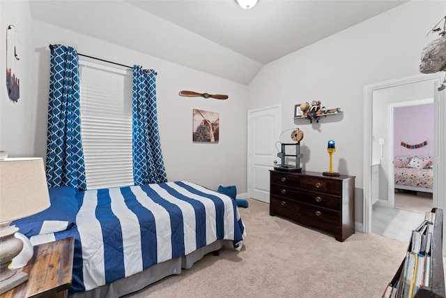 carpeted bedroom featuring vaulted ceiling