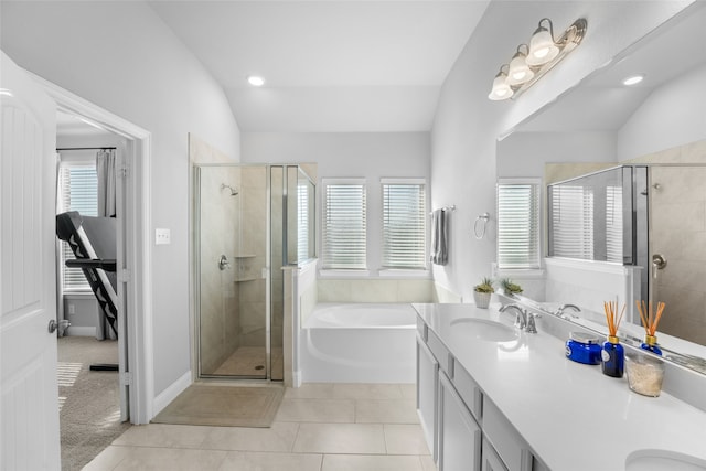 bathroom with lofted ceiling, vanity, plus walk in shower, and tile patterned floors