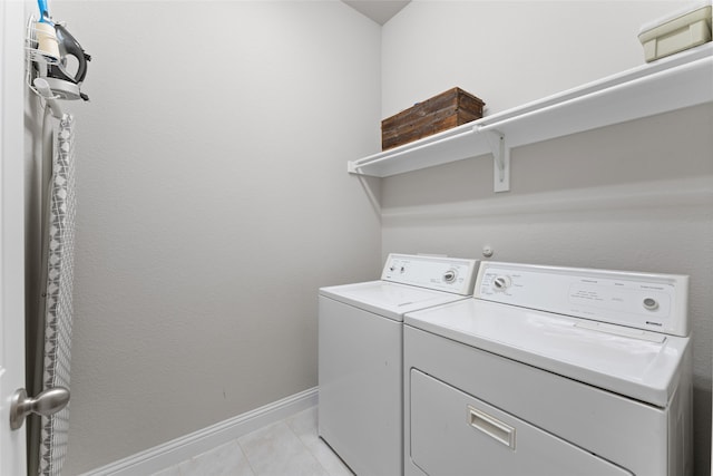 laundry area with light tile patterned flooring and independent washer and dryer