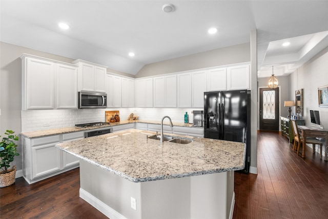 kitchen featuring dark hardwood / wood-style flooring, white cabinetry, appliances with stainless steel finishes, and sink