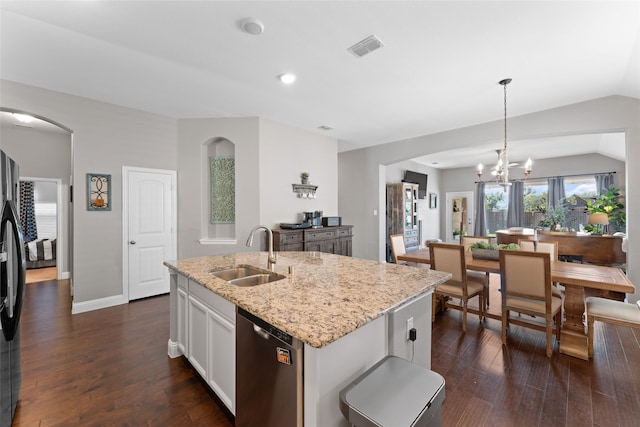 kitchen with white cabinetry, pendant lighting, stainless steel appliances, a center island with sink, and sink