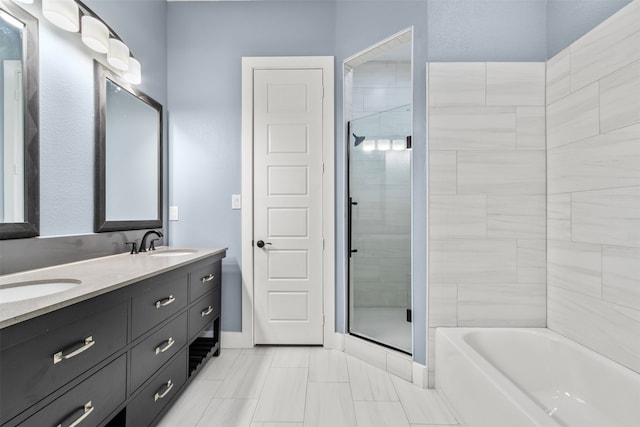 bathroom with vanity and separate shower and tub