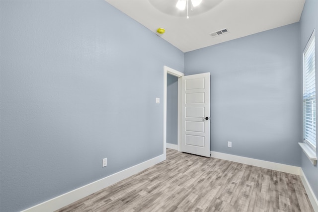 unfurnished room with ceiling fan and light hardwood / wood-style flooring